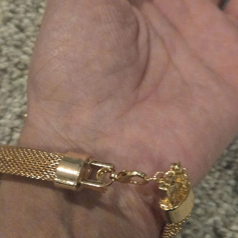 Elegant Gold Snake Bracelet with Green and Red Accents
